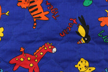 Load image into Gallery viewer, Blue background has accents of of baby animals in colors of red, orange, green, yellow and blue with an opposite side of yellow.
