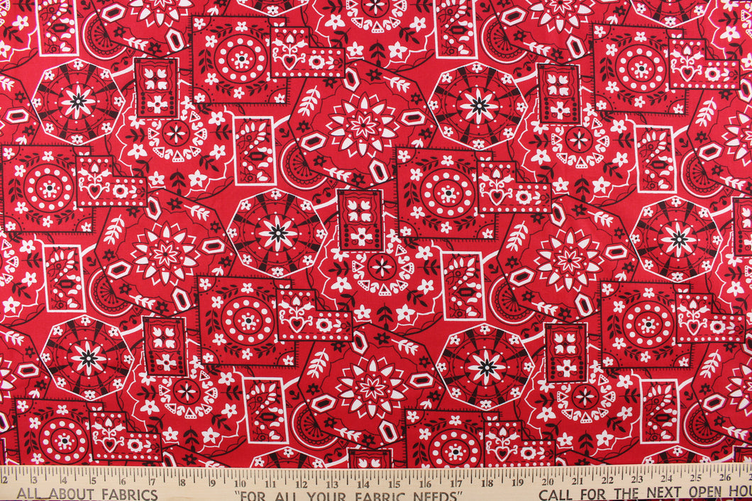 This cute and soft cotton paisley print bandana fabric features geometrical shapes with floral accents in red, white and black. 