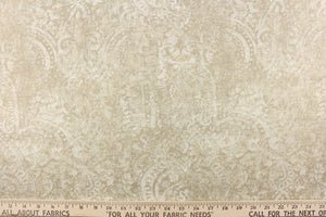  This beautiful fabric features a demask design in a beige with hints of white. 