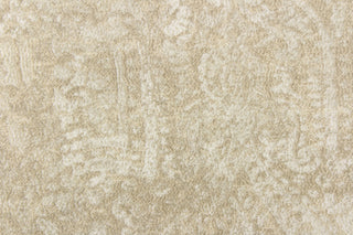 This beautiful fabric features a demask design in a beige with hints of white. 