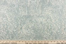 Load image into Gallery viewer, This beautiful fabric features a demask design in a blue gray with hints of white.
