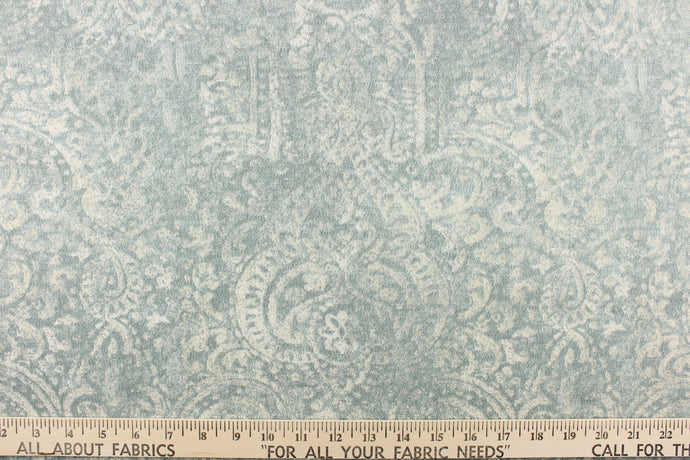 This beautiful fabric features a demask design in a blue gray with hints of white.
