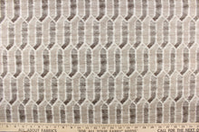 Load image into Gallery viewer, This fabric features a geometric design in brown and beige tones and white with hints of gray. 
