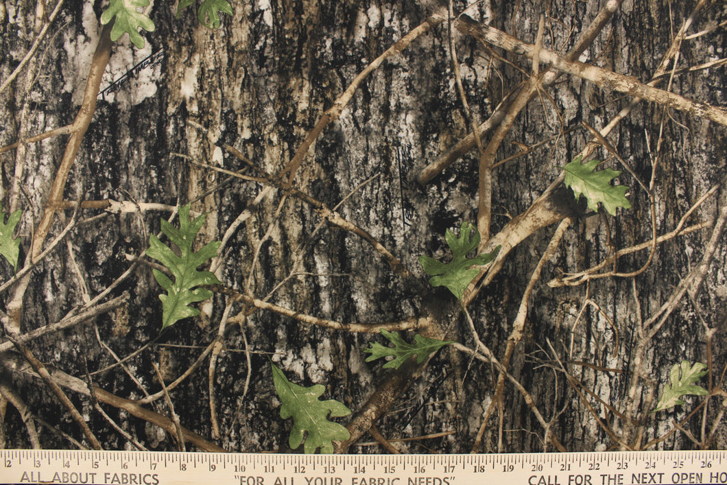 This outdoor canvas features a realistic maximum concealment camouflage design in green, brown and black.