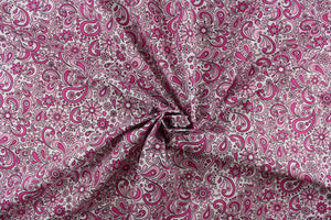 This cute and soft cotton paisley print bandana with floral accents in shades of pink outline in black against white background. 