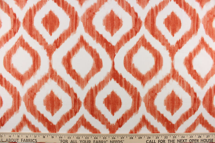 This geometric design features a diamond pattern in orange and white.