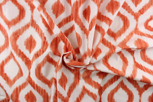 This geometric design features a diamond pattern in orange and white.