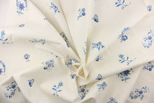 Load image into Gallery viewer, A floral blue blossom and butterfly pattern set against a creamy particulate background
