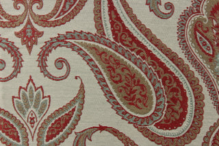  This Jacquard paisley print fabric is set against a light green background.   Colors included are red berry, taupe and green. 