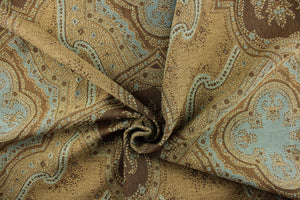 This Tapestry features a medallion and paisley design in the colors of brown and teal. 