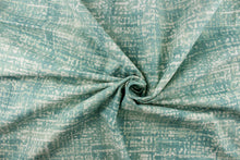 Load image into Gallery viewer, This fabric features a blot/ water color design in a pale teal blue and white with hints of gray. 
