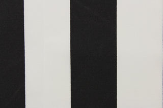 This outdoor fabric features a wide stripe design in white and black. 