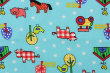 Load image into Gallery viewer, This Old MacDonald cotton print fabric features farm animals, tractors and trees in red, white, green, blue, black, yellow and pink against an aqua blue background.

