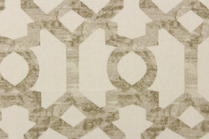  This fabric features geometric design in taupe or brown gray tones against a white background. 