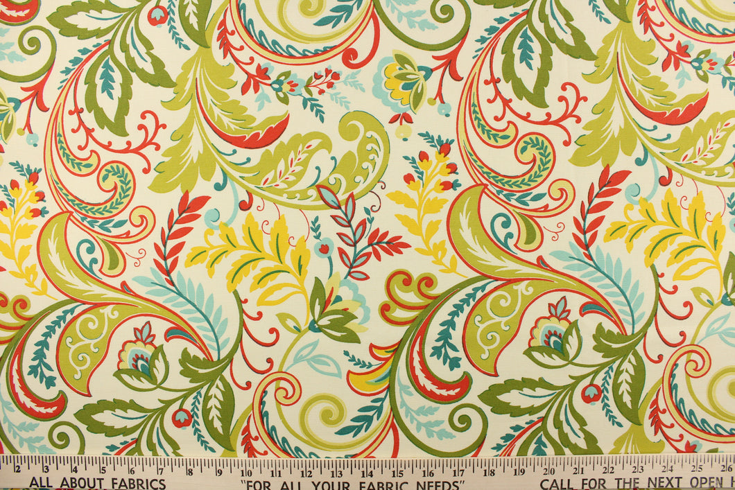 This fabric features a whimsical floral design in bright yellow, teal, lime green, beige, red, light blue and pale green against a creamy white. 