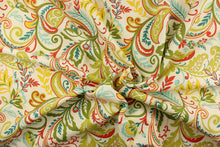 Load image into Gallery viewer, This fabric features a whimsical floral design in bright yellow, teal, lime green, beige, red, light blue and pale green against a creamy white. 
