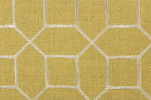 Load image into Gallery viewer, This embroidered fabric features a geometric design in white against a mustard yellow.
