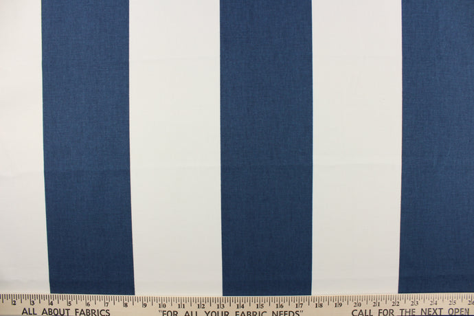 This fabric features a wide striped design in dark blue and white.