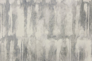 This fabric features an abstract design in shades of gray and off white.