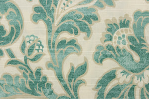 This beautiful fabric features a whimsical floral design in teal green with a beige outline against a creamy white background. 