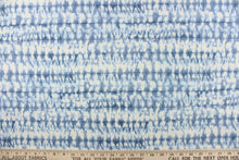 Load image into Gallery viewer,  This fabric features an abstract design in varying shades of blue and white.
