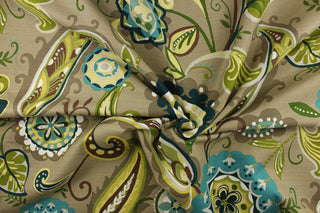 : This fabric features a brightly colored whimsical floral design in shades of green and teal with white, brown, pale yellow, hints of light gray and light khaki mixed in against a taupe background.