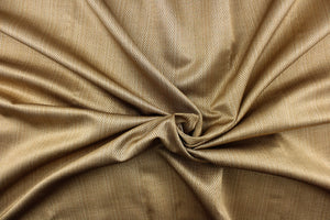 This beautiful solid true gold color fabric features a herringbone design. 