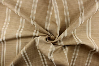  This rich woven yarn dyed fabric features bold  striped design in white, khaki and light gold tone against a khaki background. 