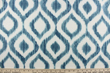 Load image into Gallery viewer, This geometric design features a diamond pattern in shades of  blue and white. 
