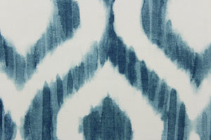 This geometric design features a diamond pattern in shades of  blue and white. 