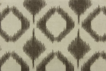Load image into Gallery viewer, This fabric features a geometric design in diamond shapes in a brown tone against a gray brown background. 
