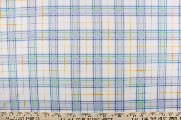  This quilting print features a plaid design in blue, white, green, and a orangey yellow.