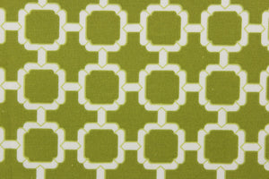 This outdoor fabric features a geometric design in white against a pear green background.