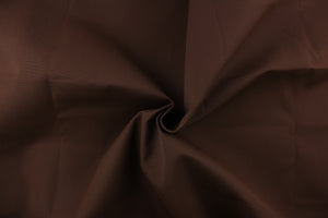This fabric in a solid true brown color is great for umbrellas, outdoor upholstery and more.