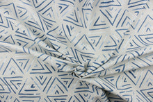 Load image into Gallery viewer,  This fabric features a geometric design of triangles in a blue jean blue color with hints of white against gray.
