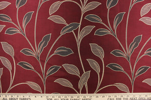 This magnificent Jacquard print features brown tropical leaves set against a  deep red background.  It has a slight sheen to enhance the look.  The pattern is woven into the fabric instead of stamped or printed.  The fabric is durable, strong and wrinkle resistant and has a structured feel.  It can be used for bedding, drapery, accent pillows, etc.