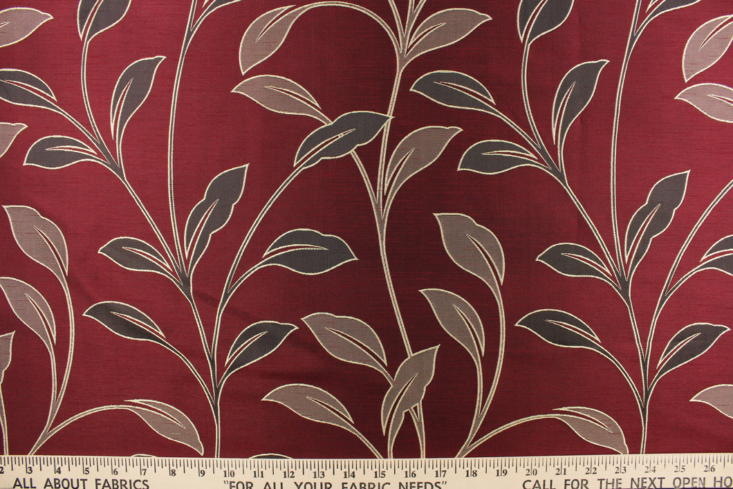 This magnificent Jacquard print features brown tropical leaves set against a  deep red background.  It has a slight sheen to enhance the look.  The pattern is woven into the fabric instead of stamped or printed.  The fabric is durable, strong and wrinkle resistant and has a structured feel.  It can be used for bedding, drapery, accent pillows, etc.