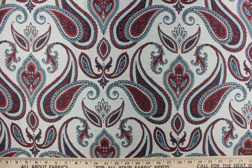 This beautiful tapestry fabric features a paisley print set on a light blue background.  It can be used for bedding, drapery and accent pillows.  It would be a great accent in any room in your home.  Colors included are red and blue.