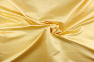  This elegant silk fabric in yellow has a lustrous look and can be used for multi purpose upholstery, bedding, accent pillows, drapery and apparel. 