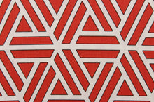 Load image into Gallery viewer, This fabric features a geometric abstract design in white, and red with black outline. 
