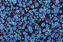 Load image into Gallery viewer, This quilting print features a beautiful floral design in shades of blue, blue green, pink, and white against a dark navy background. 
