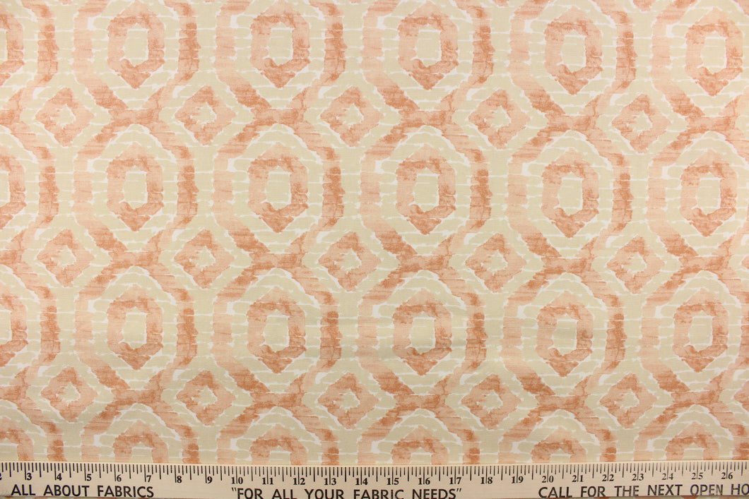  This beautiful fabric features a geometric design in a peach, light khaki and a pale orange color with hints of white.