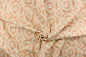  This beautiful fabric features a geometric design in a peach, light khaki and a pale orange color with hints of white.