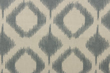Load image into Gallery viewer, This fabric features a geometric design in diamond shapes in a blue gray tone against a off white background. 
