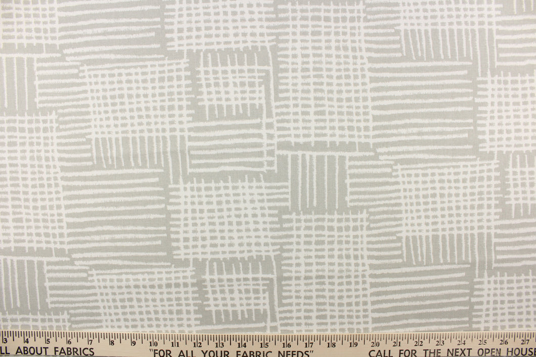 This fabric features a geometric design in gray and white. 