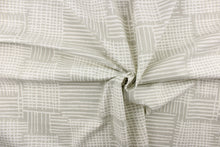 Load image into Gallery viewer, This fabric features a geometric design in gray and white. 
