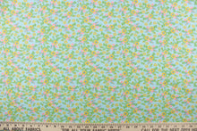 Load image into Gallery viewer, This soft quilting print features a beautiful floral design in pink, yellow, green and blue against a light blue background.
