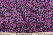 Load image into Gallery viewer,  This quilting print features a beautiful floral design in varying shades of purple, with hints of white and a deep pink against a black background.

