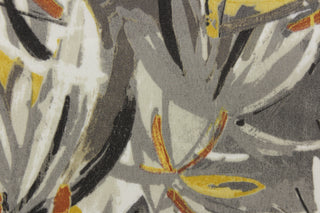 The Boca Grande fabric features a tropical vibe in autumnal colors including gray, gold, rust and white.