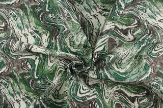 This decorative print fabric features a marble design set on a white background.  Uses include cushions, tablecloths, upholstery projects, decorative pillows and craft projects. This fabric has a slightly stiff feel but is easy to work with.  Colors included are black and green.